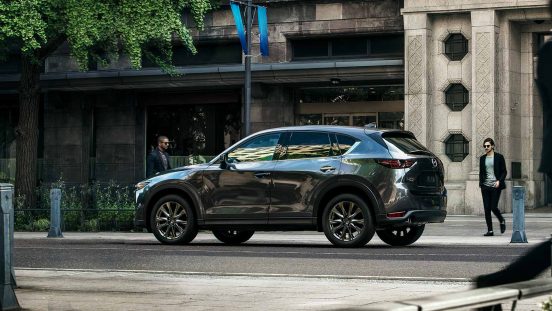 Image of a silver 2019 Mazda CX-5 parked on a city street.