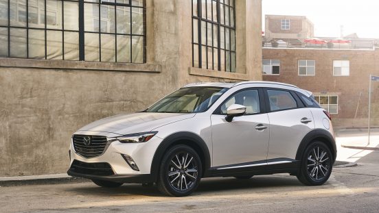 Image of a white 2019 Mazda CX-3 parked on a neighborhood street.